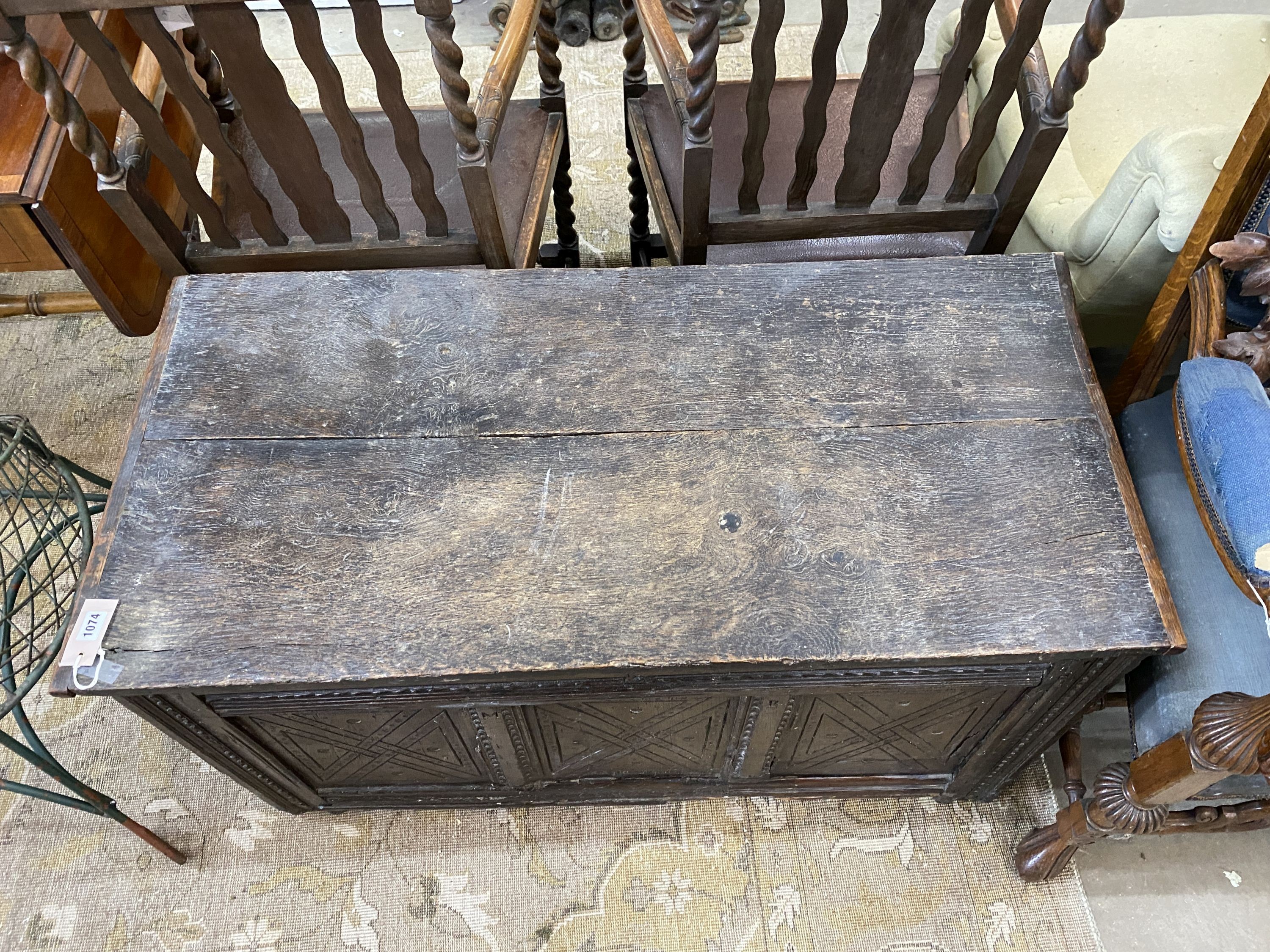 A 17th century carved oak coffer, length 110cm, depth 52cm, height 61cm